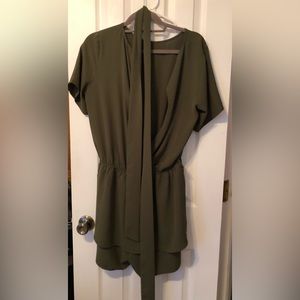 Green Romper with elastic band and belt. size Large polyester material